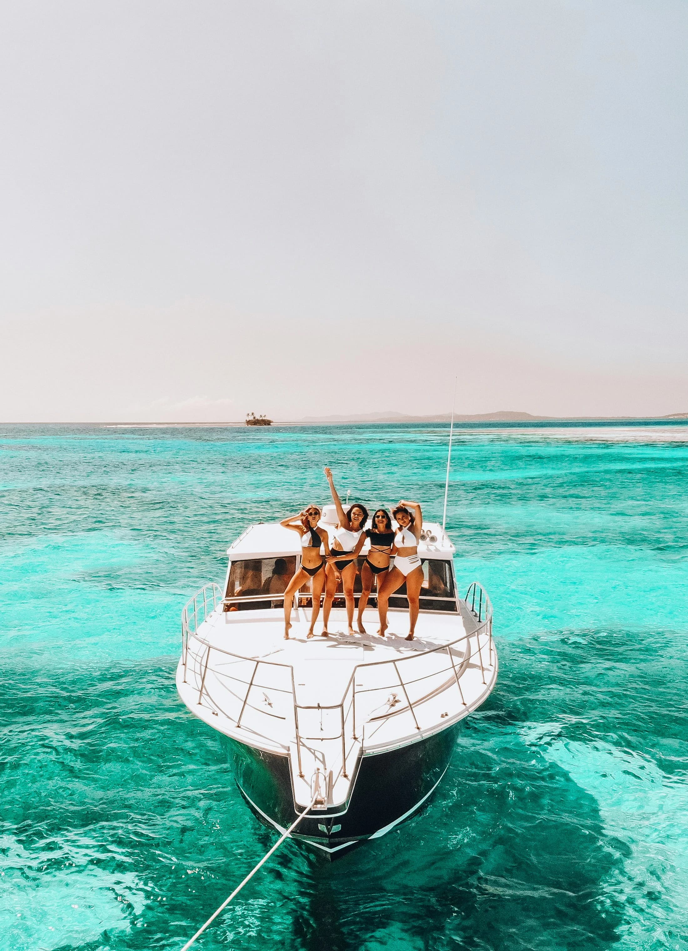 A group of friends waving from the deck