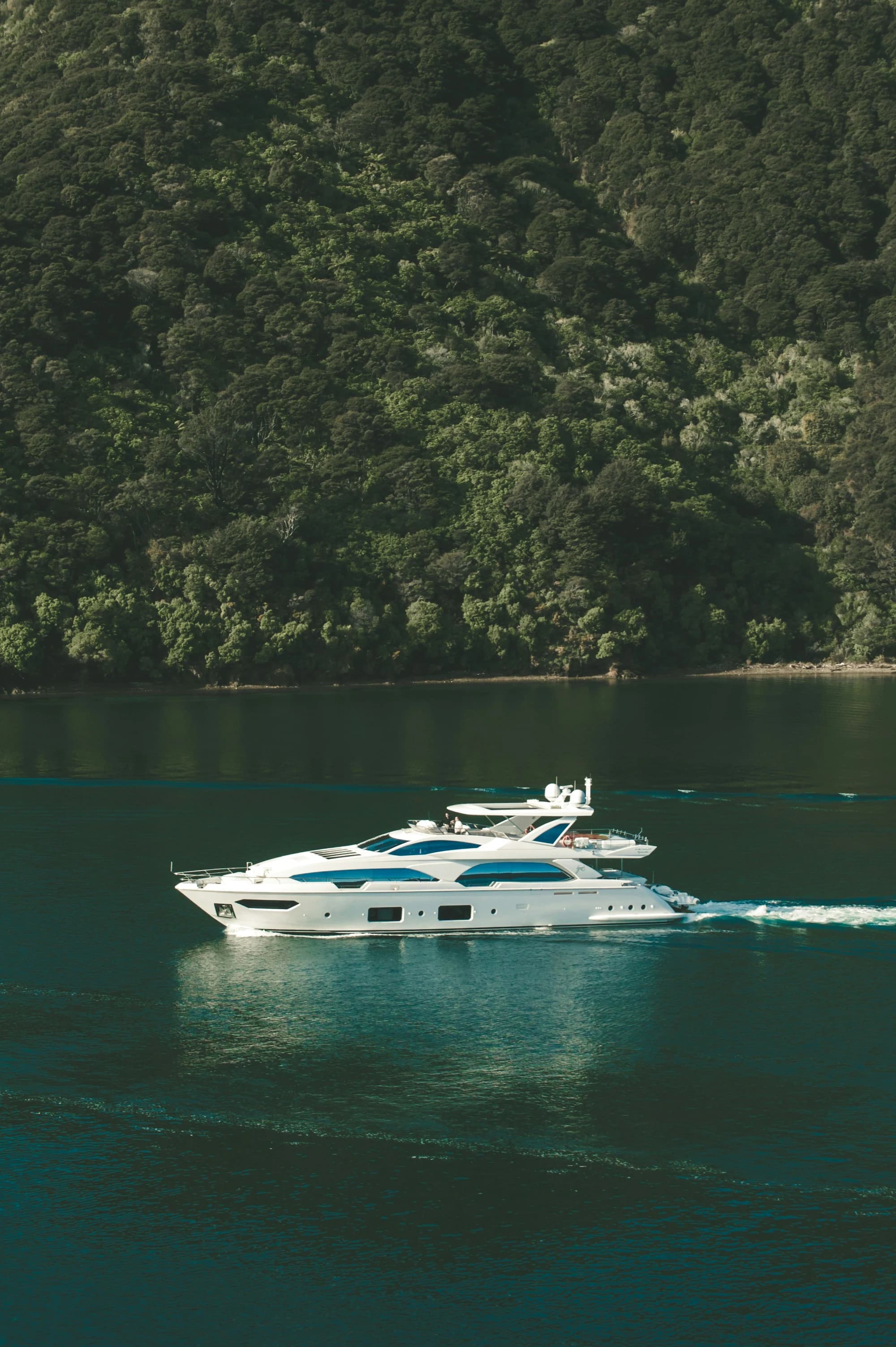 A boat motoring past a beautful island backdrop